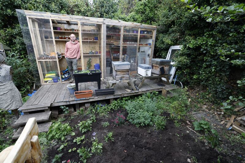 Anthony Freeman-O'Brien in his greenhouse, built with Covid screens and timber. Photograph: Nick Bradshaw