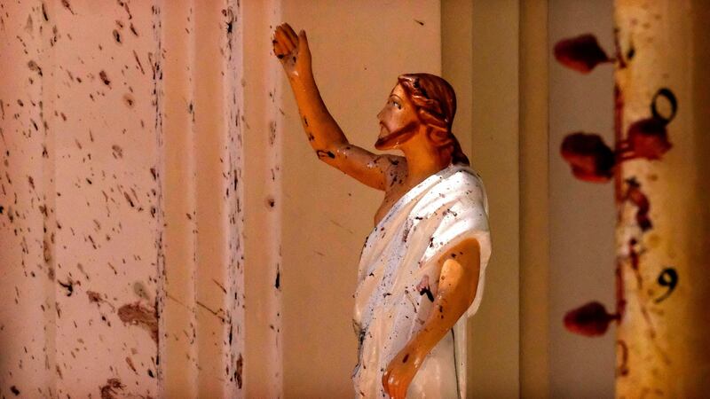 Blood stains  on the wall and Jesus Christ statue at St Sebastian Church in Negombo, north of Colombo in Sri Lanka. More than 200  people were killed in eight blasts. Photograph:  AP