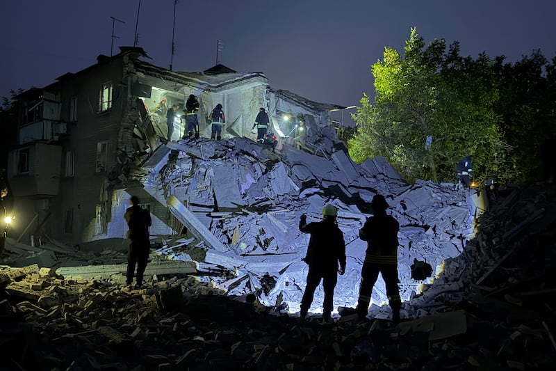 Rescuers conduct search and rescue operations following a Russian attack that struck a five-storey residential building and killed seven people, including three children, in Zaporizhzhia on October 10th amid Russia's invasion of Ukraine. Photograph: Daria Nazarova/AFP via Getty Images