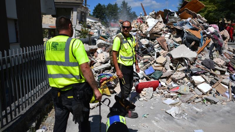 Emergency workers continue on Thursday to search buildings destroyed during an earthquake in Amatrice, Italy. Photograph: Carl Court/Getty Images
