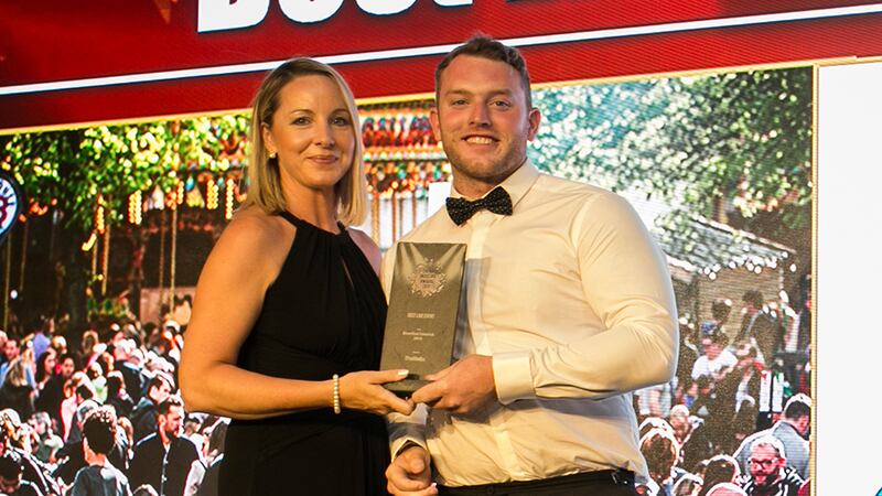 Declan Maxwell, Restaurant Manager, Luna Restaurant presents the Best Purpose Build Event Venue award to Sinead Heneghan, Croke Park Meetings & Events