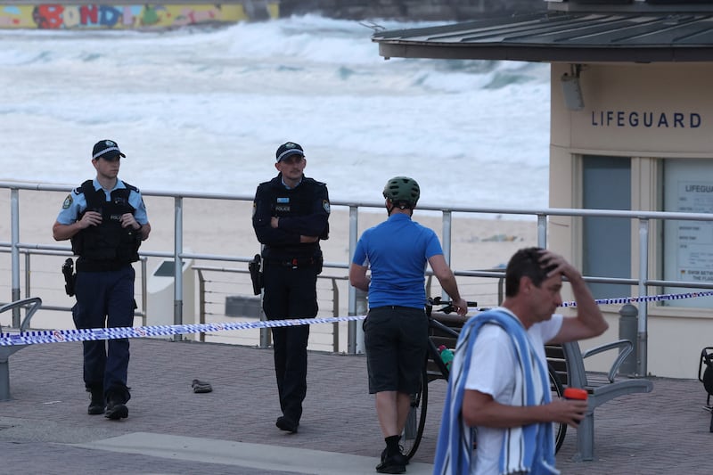 Police officers at the scene of the shooting. Photograph: David Gray/Getty