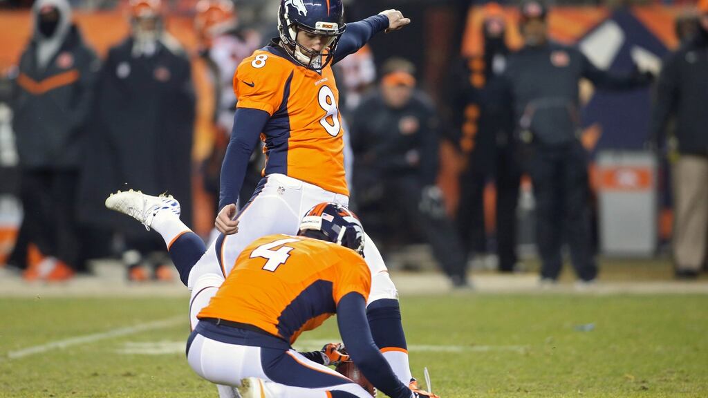 Denver Broncos kicker Brandon McManus kicks the winning field goal during the overtime period against the Cincinnati Bengals at Sports Authority Field at Mile High. The Broncos won 20-17 in overtime.