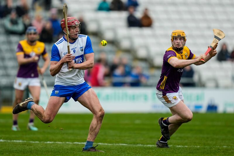 Calum Lyons of Waterford with Conor Foley of Wexford - only 3,571 turned up to see the game on Sunday. It is hard to imagine pulling power will be increased by being in the second tier. Photograph: James Lawlor/Inpho
