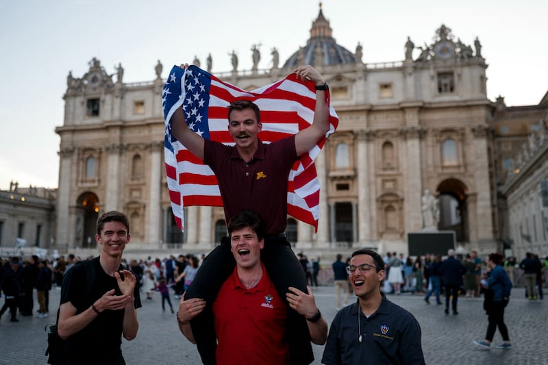 A man waves a US flag in St Peter's Square. Photo: Getty Images