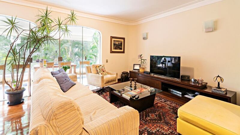 This four-bedroom Brazilian apartment has a terrace overlooking  green communal gardens
