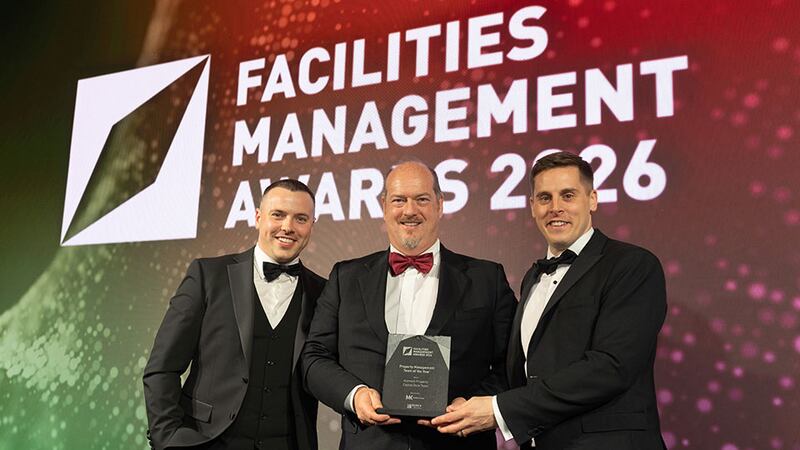 Bernard MacOscair, managing director, Berka Solutions, presents the property management team of the year award to Drew Armstrong and Kyle Denny, Aramark Property