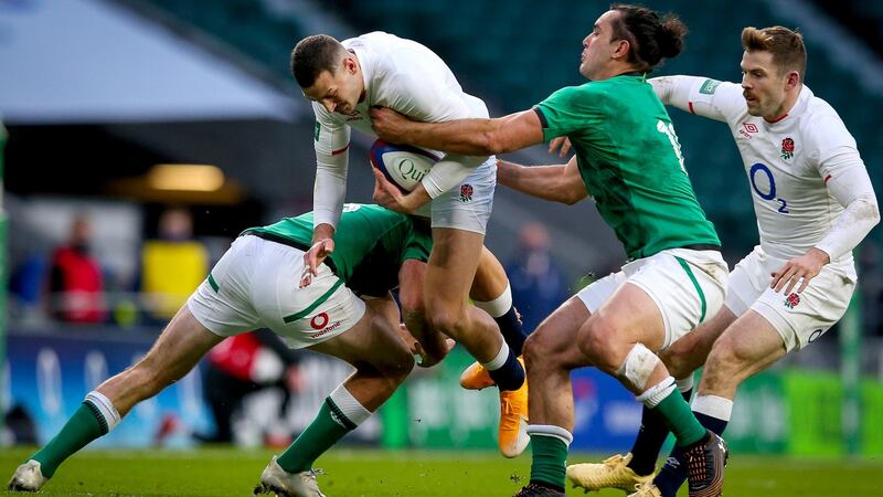 England’s Jonny May is tackled by Hugo Keenan and James Lowe of Ireland. Photograph: Craig Mercer/Inpho