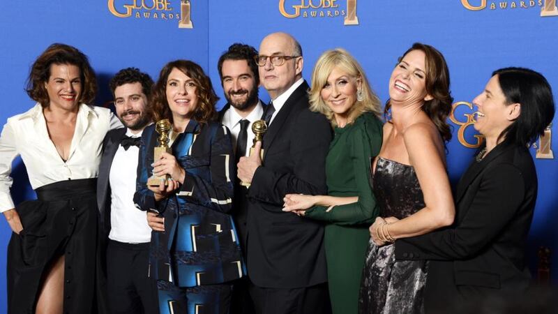Jill Soloway (3rd from left) Jeffrey Trambor (4th from right) and the cast of Transparent pose with their award, Best television comedy or musical and Best actor in a TV comedy or musical award during the 72nd Annual Golden Globe Awards at the Beverly Hilton Hotel, in Beverly Hills. Photograph: Paul Buck/EPA