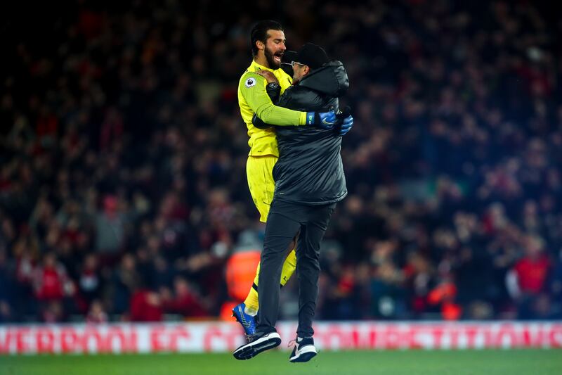Klopp  celebrates with Liverpool goalkeeper Alisson Becker after Divock Origi’s 96th minute winning-goal against Everton on December 2nd Photograph: Robbie Jay Barratt/AMA/Getty