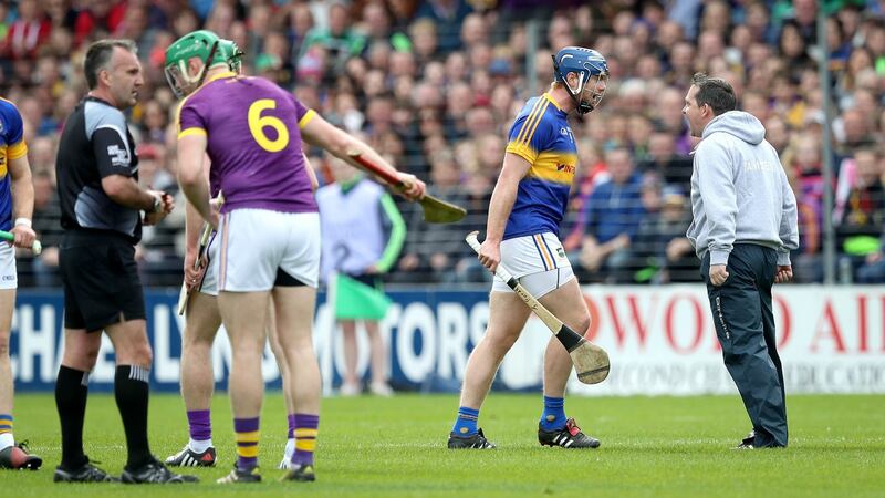 Davy Fitzgerald clashes with Jason Forde of Tipperary during the  Allianz Hurling League Division 1A semi-final at Nowlan Park in Kilkenny. Photograph:  ©INPHO/Ryan Byrne