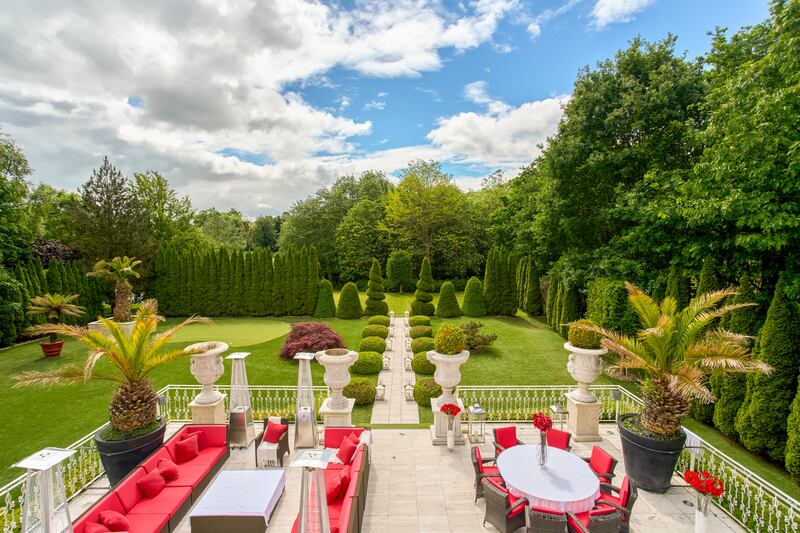 Terrace to back of house overlooking immaculate gardens