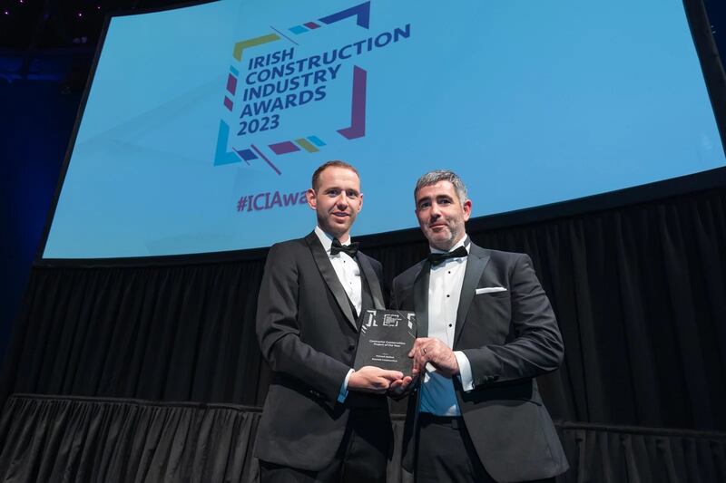 Brendan Mitchell, regional director at Meinhardt Ireland, presents the contractor conservation project of the year award to Paul Bruton, Bennett Construction