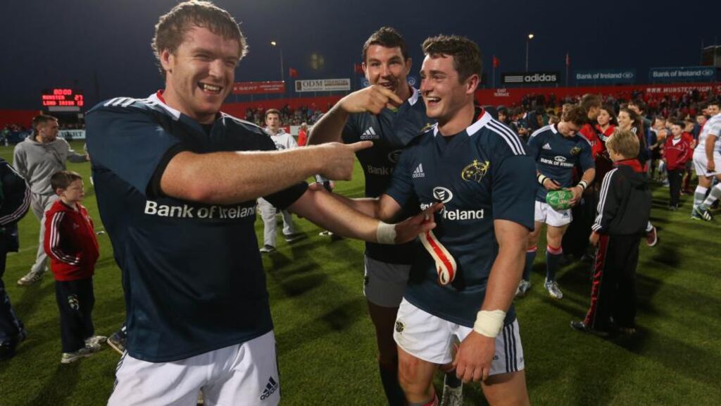 Munster’s Mike Sherry and Paddy Butler congratulate Ronan O’Mahony (centre) after he got a hat trick of tries against London Irish at Musgrave Park. Photograph: Billy Stickland/Inpho