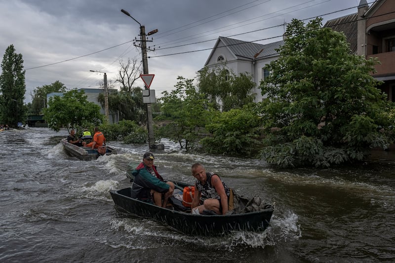 Residents were trapped by floodwaters from the breached Kakhovka dam, in Kherson, Ukraine, in June 2023. Photograph: Daniel Berehulak/The New York Times