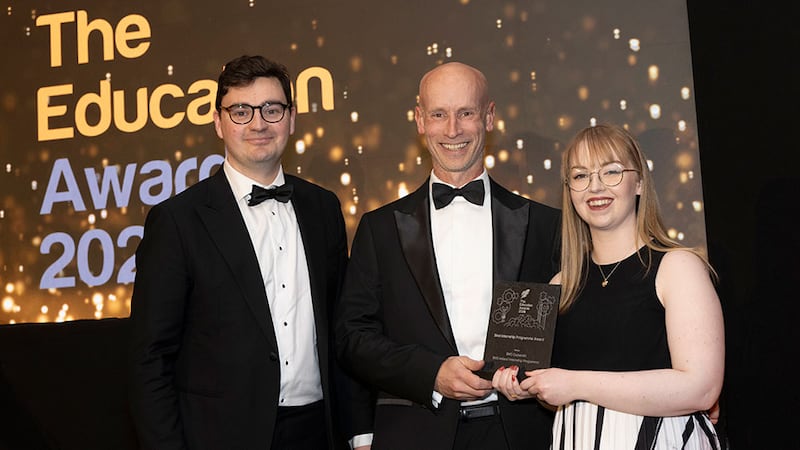 Lorcan O'Connor Lloyd, awards judge, presents the best internship programme award to Fiona Stapleton and Padraig Landers, BMS Cruiserath