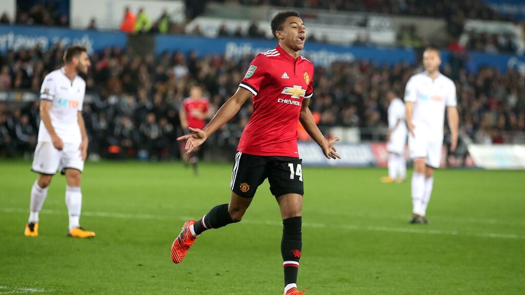 Manchester United’s Jesse Lingard celebrates his first goal at the Liberty Stadium. Photograph: PA