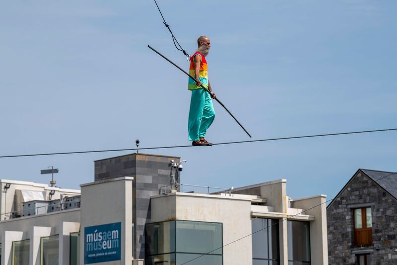 LifeLine at the Galway International Arts Festival  presented by Galway Community Circus. Andrea Loreni Torini crossing the waterways of Galway in glorious sunshine. Photograph: Andrew Downes, xposure