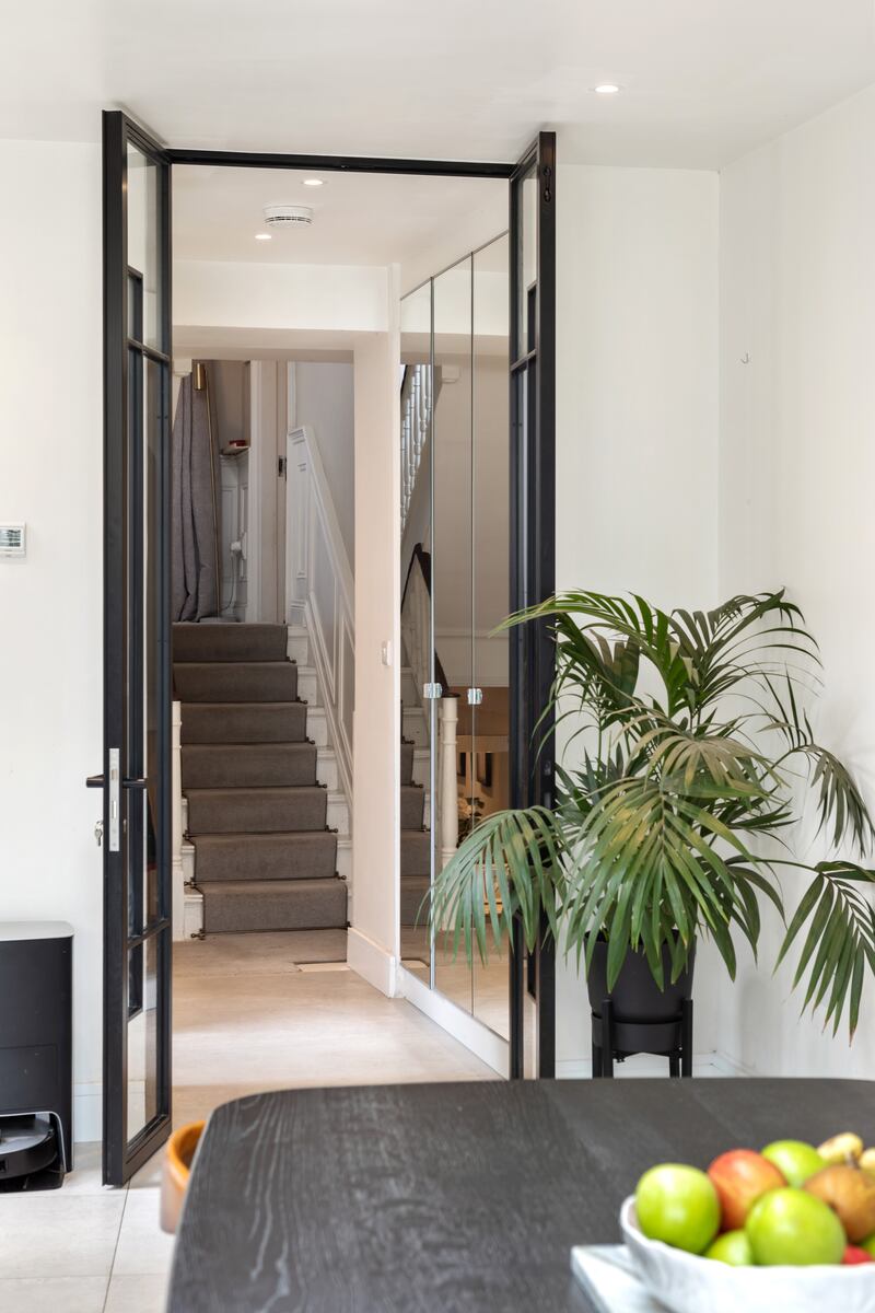 Doors from kitchen extension into hallway
