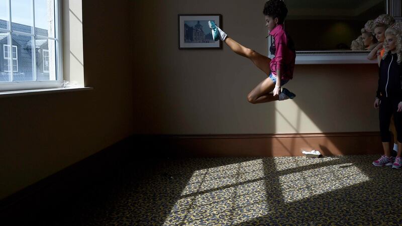 Aibhin Kenneally (13) from the Flynn-O’Kane dance group warms up backstage before performing at the World Irish Dancing Championships. Photograph: Reuters