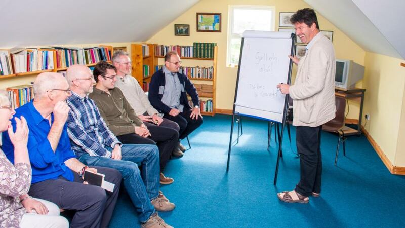 Teacher Diarmuid Johnson puts Michael McCaughan and  fellow students through their paces in Oideas Gael.  Photograph: Jason McGarrigle