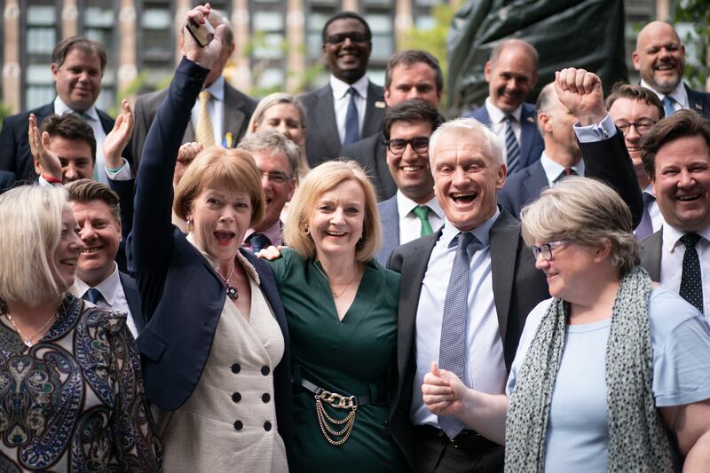 British foreign secretary Liz Truss celebrates with supporters after making it through with Rishi Sunak to the final run-off in the Conservative party leadership race. Photograph: Stefan Rousseau/PA