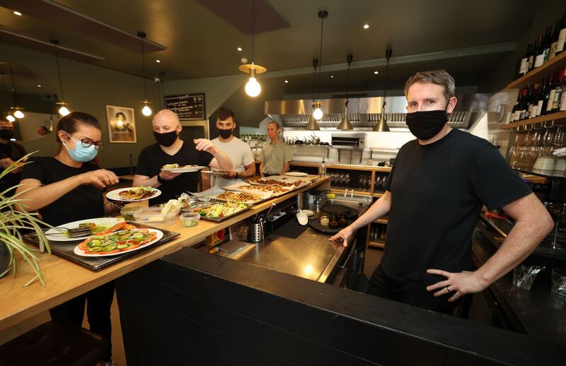 Bastible and Clanbrassil House: owner Barry Fitzgerald (right) with staff gathering for family meal. Photograph: Nick Bradshaw