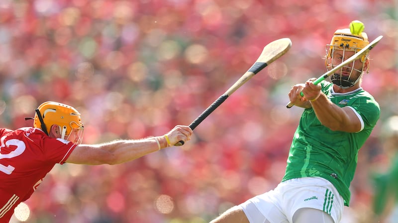 Cork’s Shane Barrett attempts a block on Limerick's Tom Morrissey. Photograph: James Crombie/Inpho