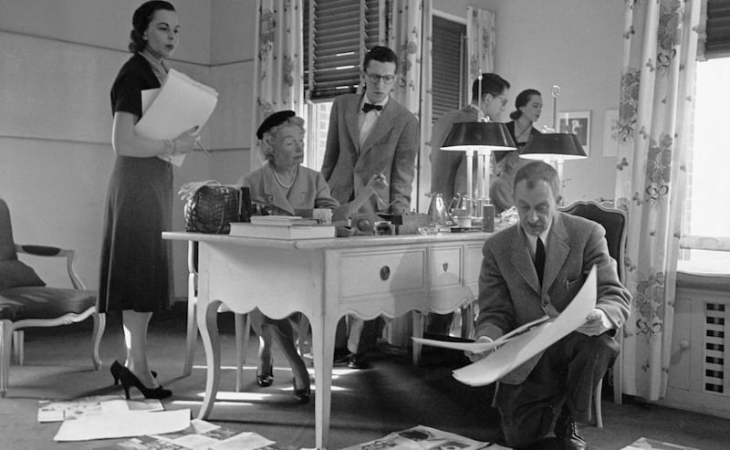 Carmel Snow (sitting at the desk) with colleagues at Harper’s Bazaar in 1952. Photograph: Walter Sanders/Life/Getty