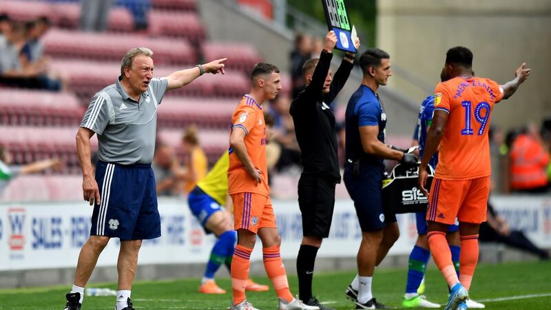 Cardiff City manager Neil Warnock speaks with   Nathaniel Mendez-Laing during thier defeat at Wigan. Photo: Anthony Devlin/PA Wire.