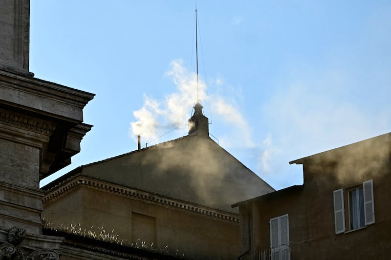 White smoke rising from the chimney of the Sistine Chapel this evening. Photo Tiziana FABI / AFP