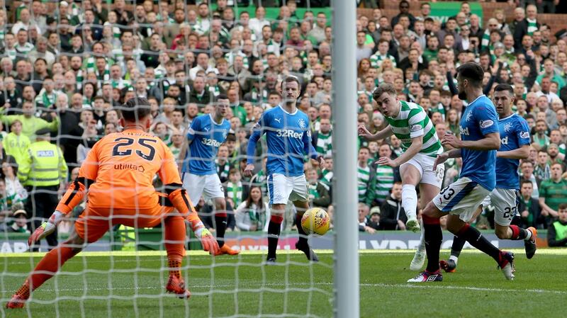 Celtic’s James Forrest scores his side’s third in their 5-0 thrashing of Rangers. Photograph: Jane Barlow/PA
