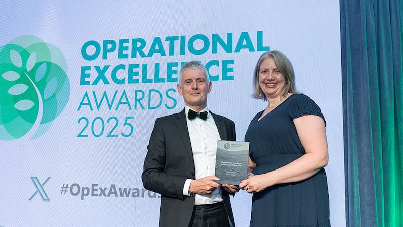 Seamus O'Reilly, awards judge, presents the operational excellence in third-level education award to Karen Sutton, Griffith College