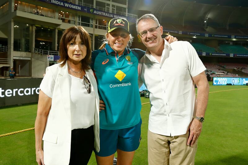 Kim Garth with her parents Anne-Marie and Johnny, after she received her debut cap for Australia during the T20 series against India in Mumbai. Photograph: Pankaj Nangia/Getty Images