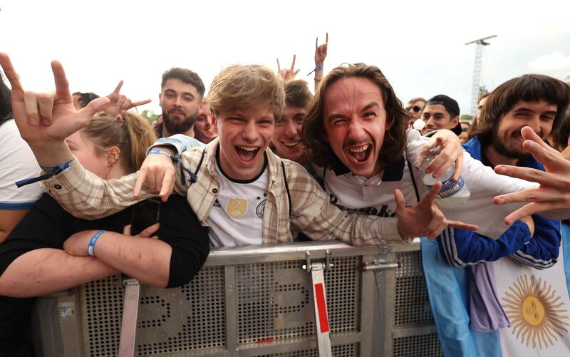 Luke Jacob, from Bray, Leo Fortune, from Greystones, and Rob Zieba, from Bray, enjoy The Red Hot Chili Peppers play in Marlay Park, Dublin. Photograph: Damien Eagers
