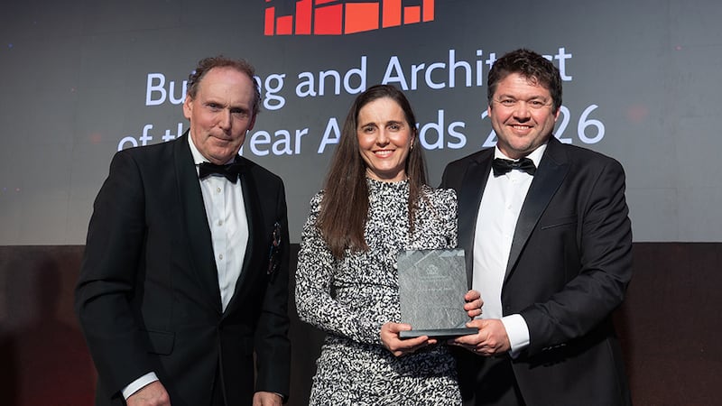 Ray Byrne, group sales and marketing director at Stacked, presents the building of the year - office to Emma Graves and Andy Buchan, Henry J Lyons