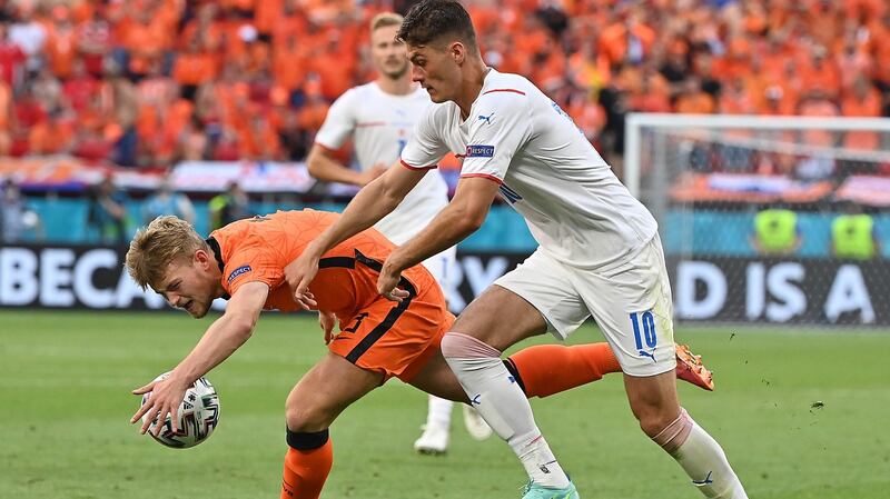 Matthijs de Ligt of the Netherlands handles the ball under pressure from  Patrik Schick of the Czech Republic, leading to the Dutch defender being sent off during the round of 16 game in Budapest. Photograph: Tibor Illyes/EPA