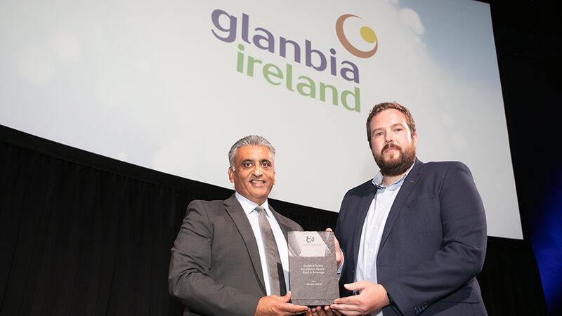 Sanjay Patel, Key Account Director at ISS Facility Services, presents the Health & Safety Excellence Award - Food & Beverage to Edward Elder, Glanbia Ireland.