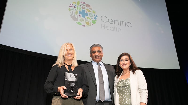 Sanjay Patel, Key Account Director at ISS Facility Services, presents the Health & Safety Excellence Award - Healthcare to Aine Kiely and Marian Mulcahy, Centric Health.
