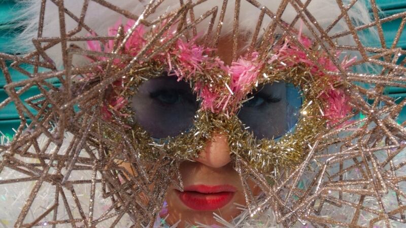 Atomic Starlet made from four deconstructed glitter star decorations which I layered across tinsel trimmed lenses at various angles.