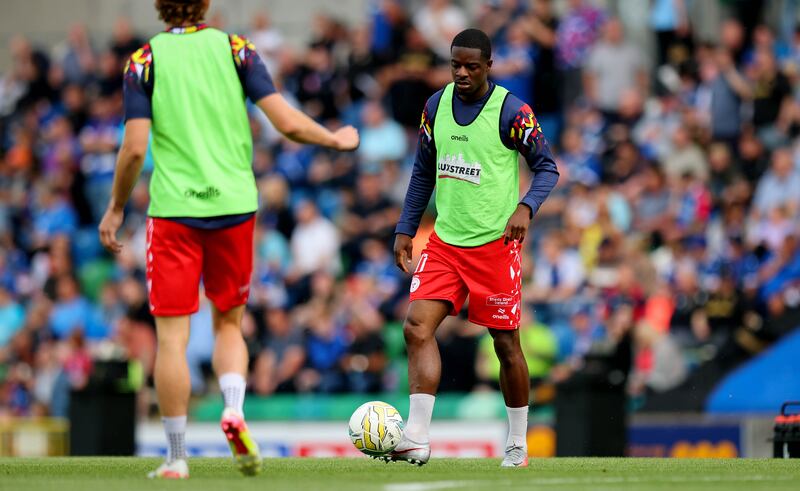 Shelbourne's Mipo Odubeko warms up ahead of kick-off. Photograph: Ryan Byrne/Inpho