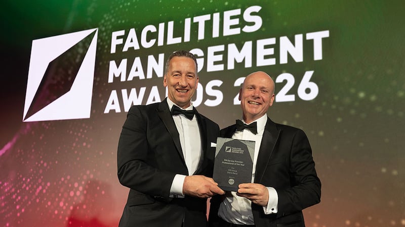 Francis Lyons, chief executive, ECAT Group, presents the FM service provider professional of the year award to Shane Darcy, SOS Group
