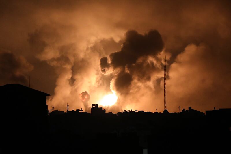 Explosions caused by Israeli air strikes light up the sky above the northern Gaza Strip. Photograph: Abed Khaled/AP