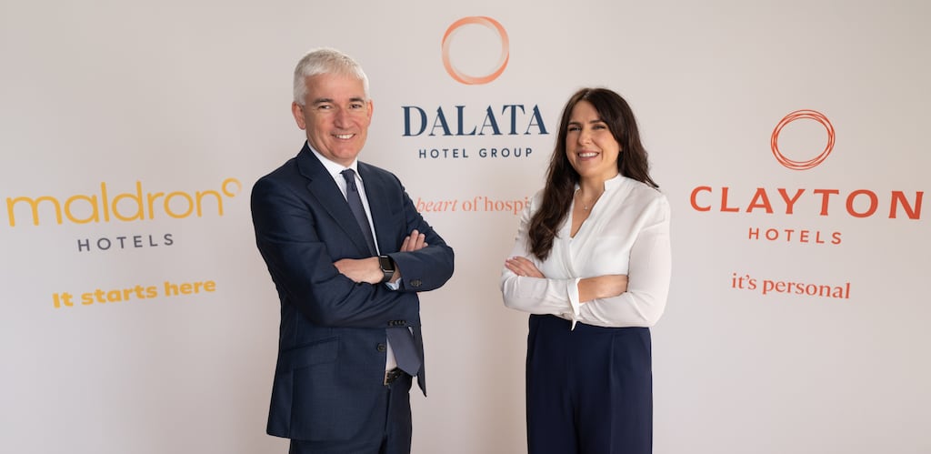 Dalata CEO Dermot Crowley and chief marketing officer Roma O'Connor pictured with images of the hotel group's new corporate brands. Photograph: Matthieu Chardon