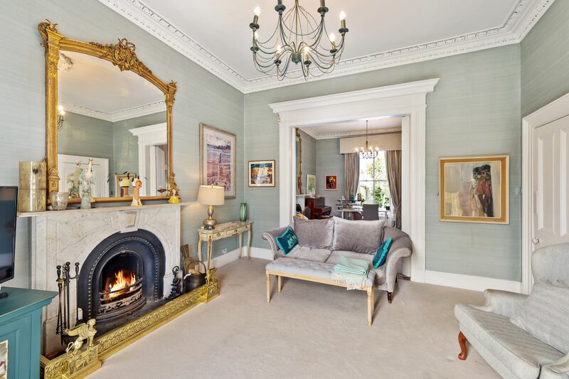 Interconnected reception rooms with dining room beyond