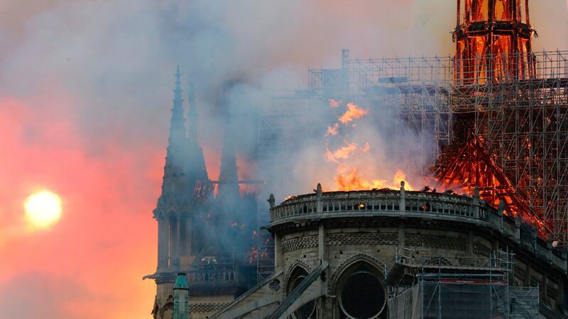 Smoke billows as flames destroy the roof of the landmark Notre Dame cathedral in central Paris. Photograph: FRANCOIS GUILLOT/AFP/Getty Images