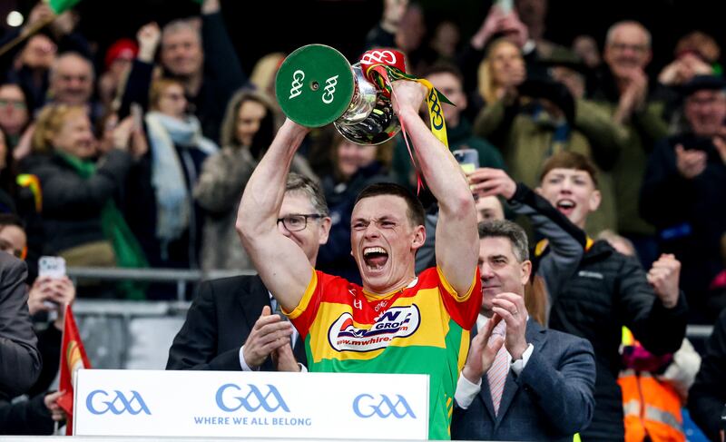 Mikey Bambrick lifts the NFL Division 4 Cup after Carlow's win over Longford. Photograph: Nick Elliott/Inpho