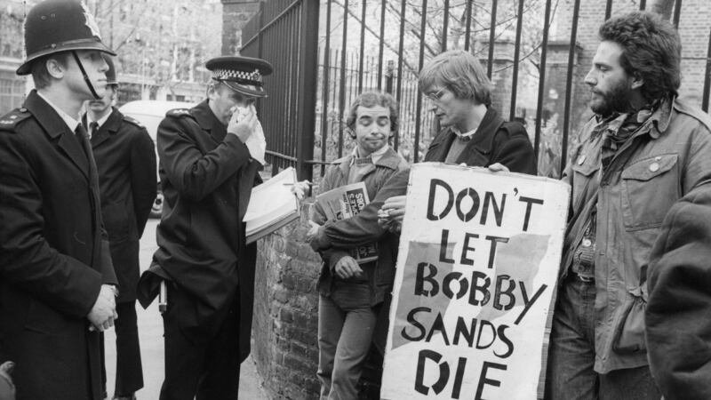 May 1981: A policeman talksto hunger strike sympathisers bearing banners on behalf of  Bobby Sands, during a May Day march at Clerkenwell Green in London. Photograph: Central Press/Getty Images