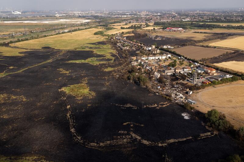 Doomsday prophecies and the climate: The scene in July 2022 after a blaze in the village of Wennington, east London, after temperatures topped 40C in the UK for the first time ever. Photograph: Aaron Chown/PA