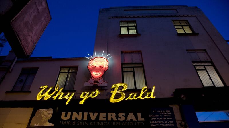 The iconic  neon sign  on the side of the Universal Hair and Scalp clinic in South Great George’s Street, Dublin